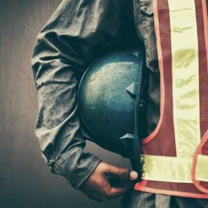 Person holding hard hat wearing vest